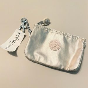 Kipling Mini Creativity. Color is “cloud metal”. In new condition.